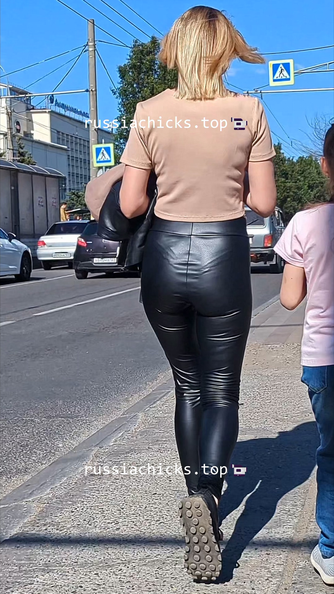 sexy woman ass in leather leggings