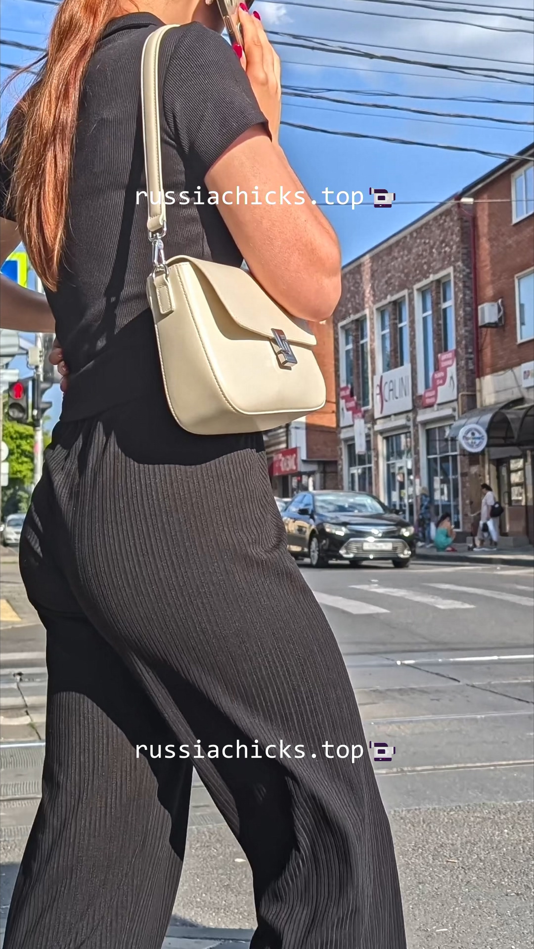 teen girl in nice pants on street